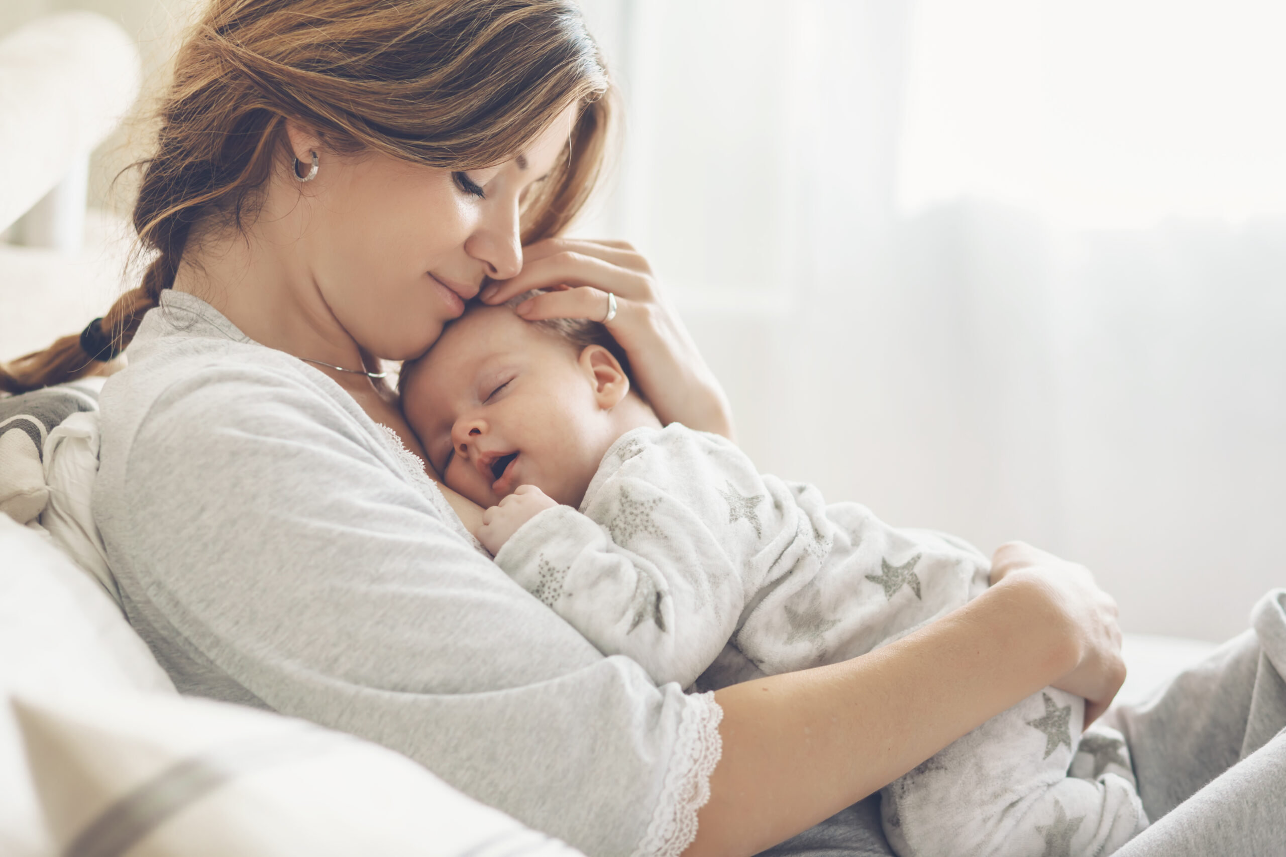 baby sleeping on mom