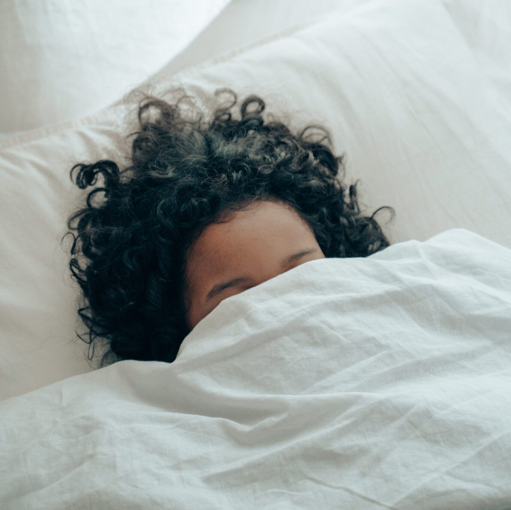 woman sleeping with covers at face girl sleeping with covers over face